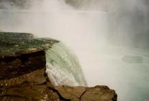 The edge of Horseshoe Falls with the Maid of the Mist in the background